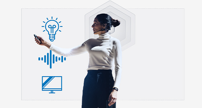 Woman giving a presentation with a headset, and presentation remote with illustrative icons around her